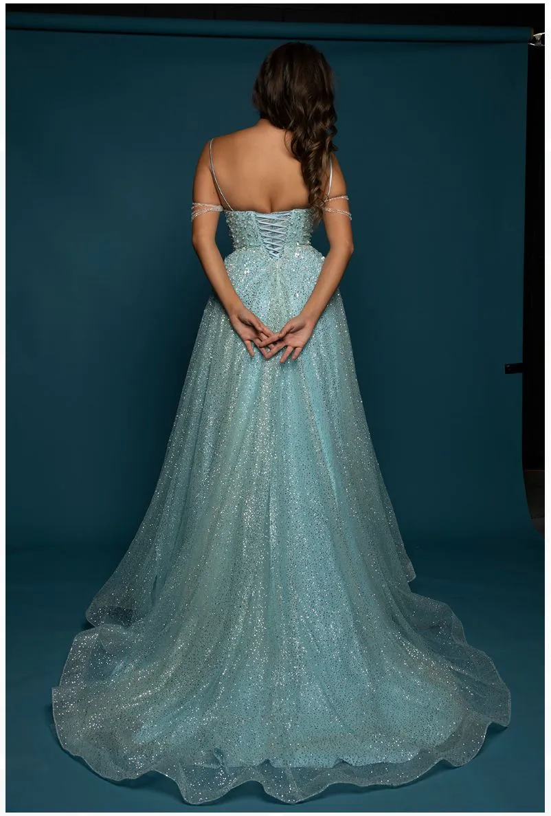 Sparkling baby blue princess dress with crescent moon neckline and crystal off the shoulders